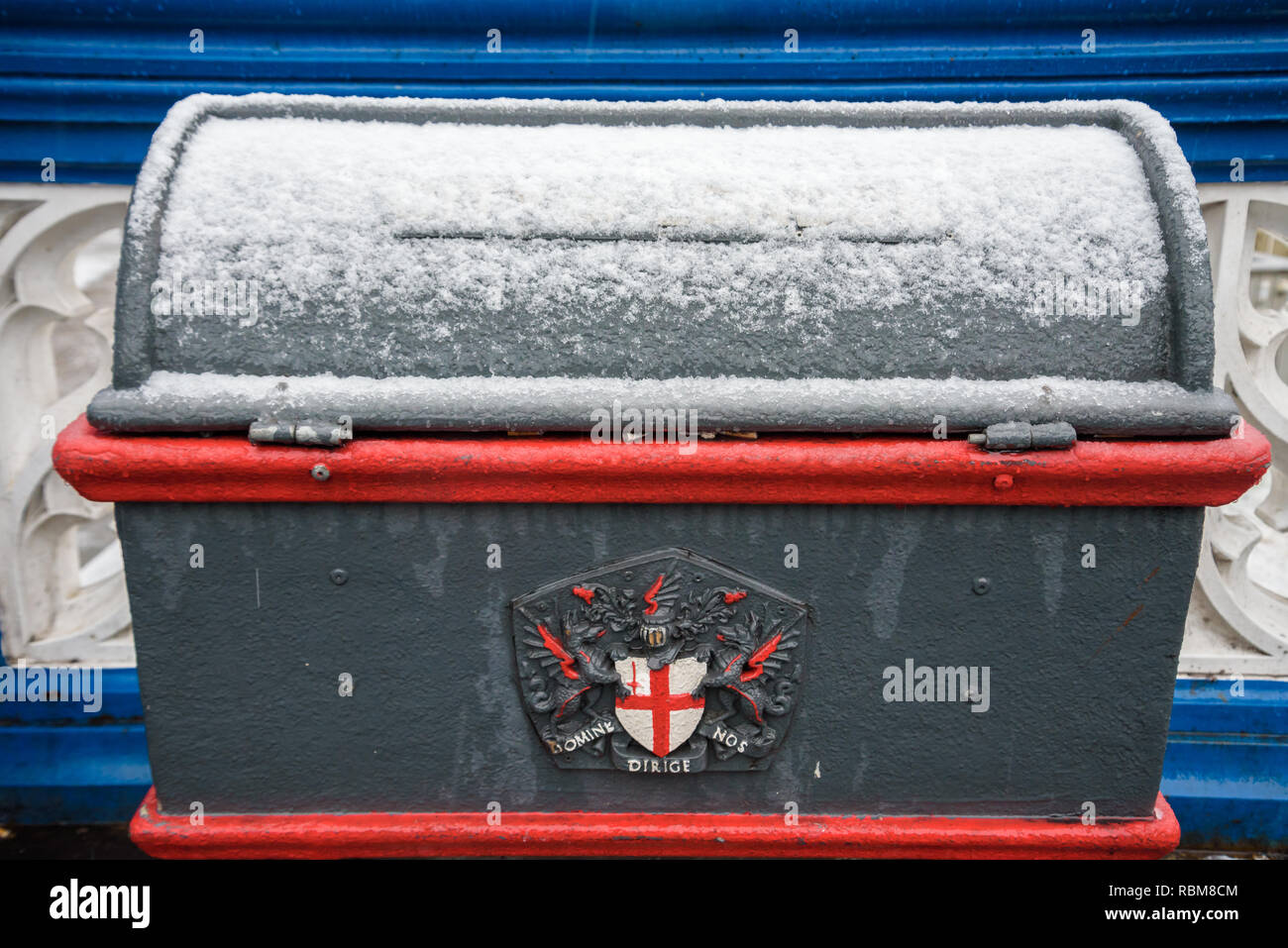 Road salt / grit bin covered in fresh snow after the Beast from the East cold weather front. London, UK. Stock Photo
