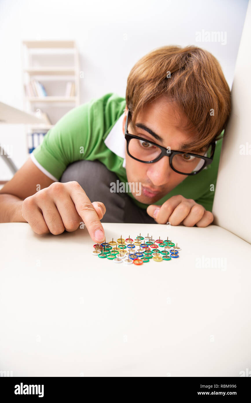 Office prank with sharp thumbtacks on chair Stock Photo Alamy