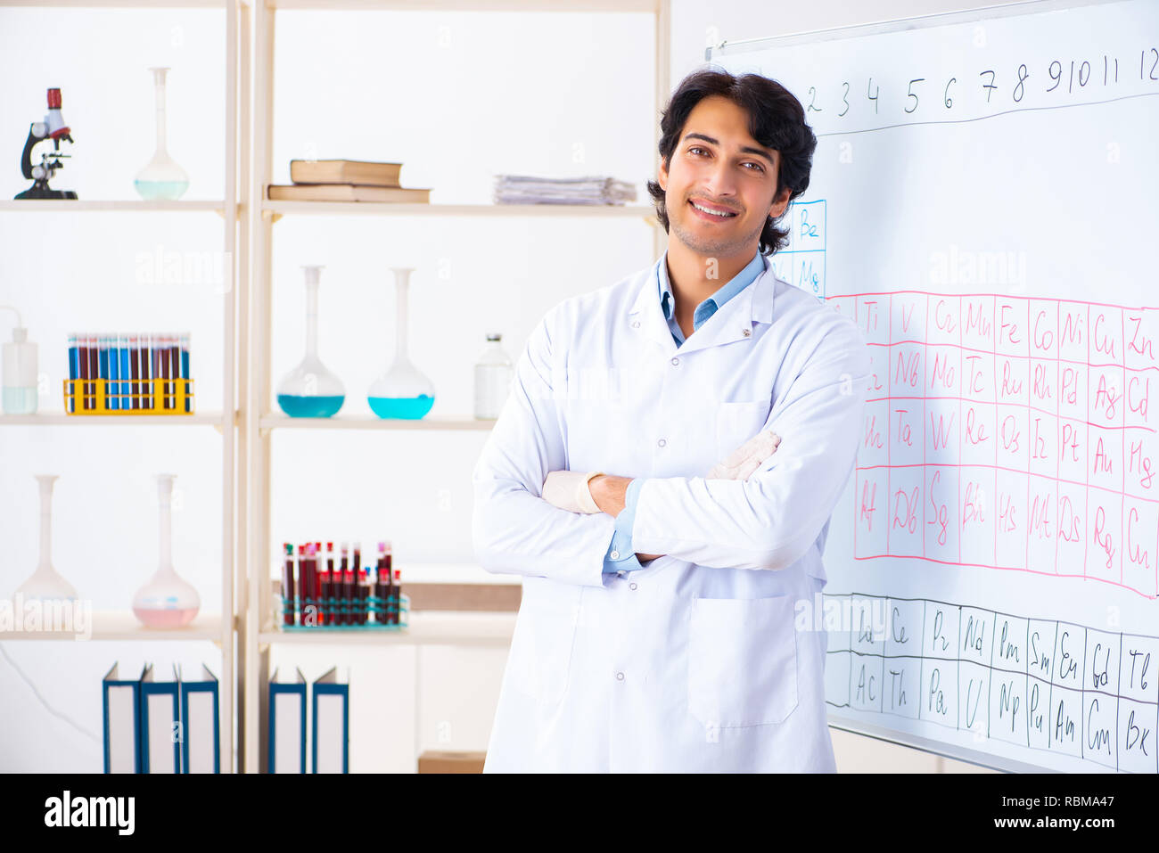 Young chemist working in the lab Stock Photo