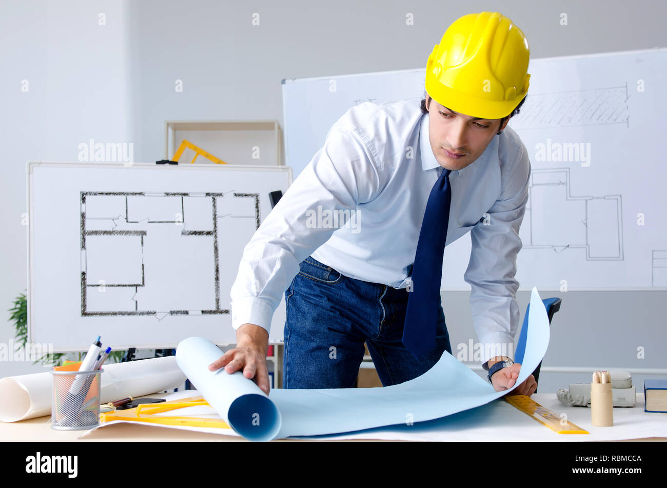 Young handsome architect working on the project Stock Photo