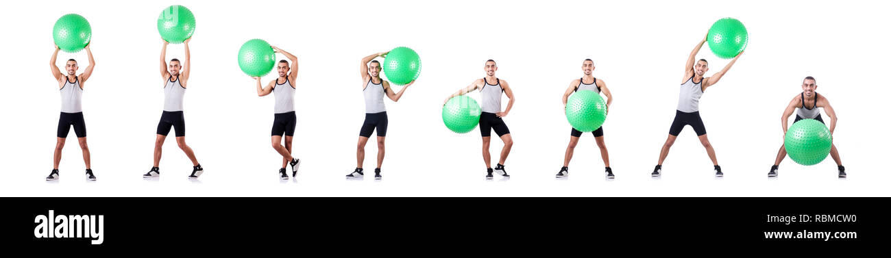 Man with swiss ball doing exercises on white Stock Photo - Alamy
