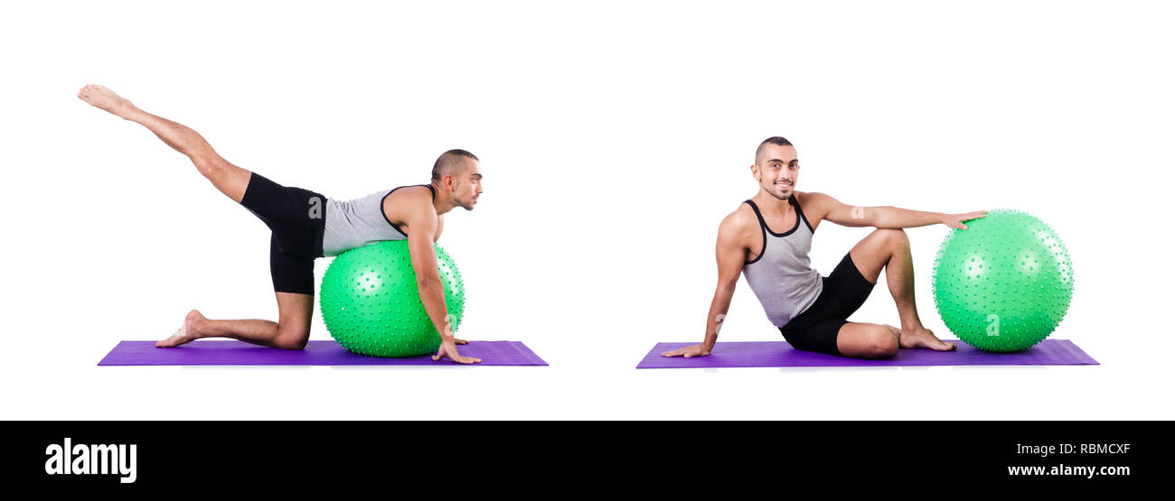 Man with swiss ball doing exercises on white Stock Photo - Alamy