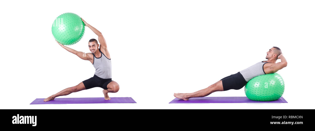 Man with swiss ball doing exercises on white Stock Photo - Alamy