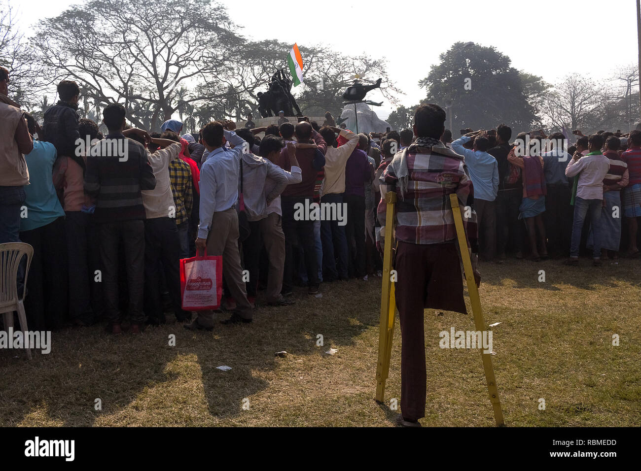 Man on crutches, Republic Day crowd, Red Road, Kolkata, West Bengal, India, Asia Stock Photo