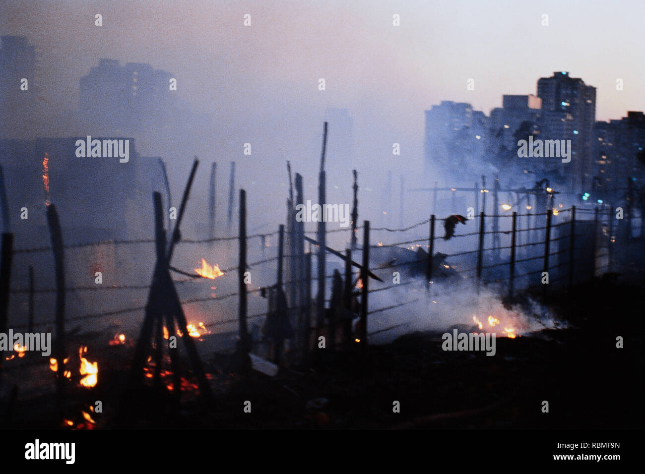 Slums burning in fire, Colaba, Mumbai, Maharashtra, India, Asia Stock Photo