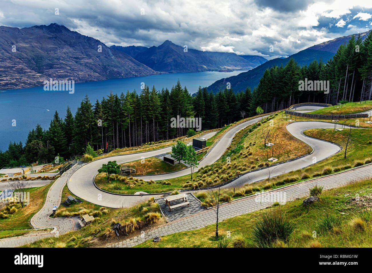 Luge track on the mountain in Queenstown with a beatiful lake Wakatipu and mountains view Stock Photo