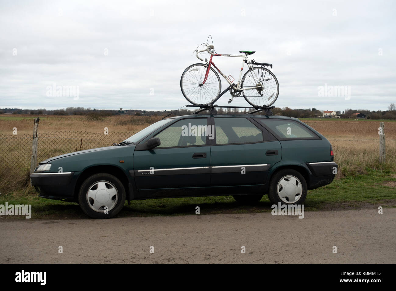 Citroen ZX with bicycle on roof rack Stock Photo