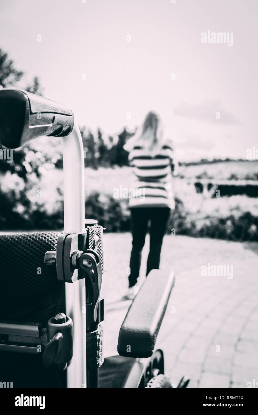 Man in wheelchair woman friend hi-res stock photography and images - Alamy