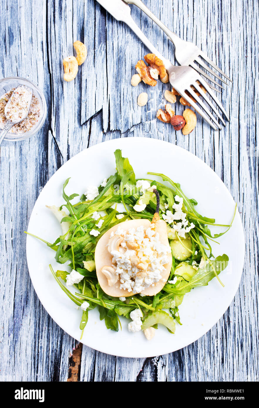 Salad with green arugula plant, pear and cottage cheese Stock Photo Alamy