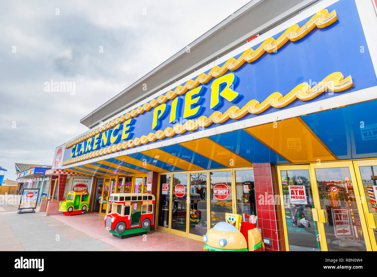 Promenade view of colourful Clarence Pier, a popular large seafront