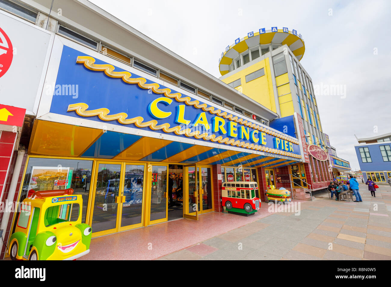 Promenade view of colourful Clarence Pier, a popular large seafront