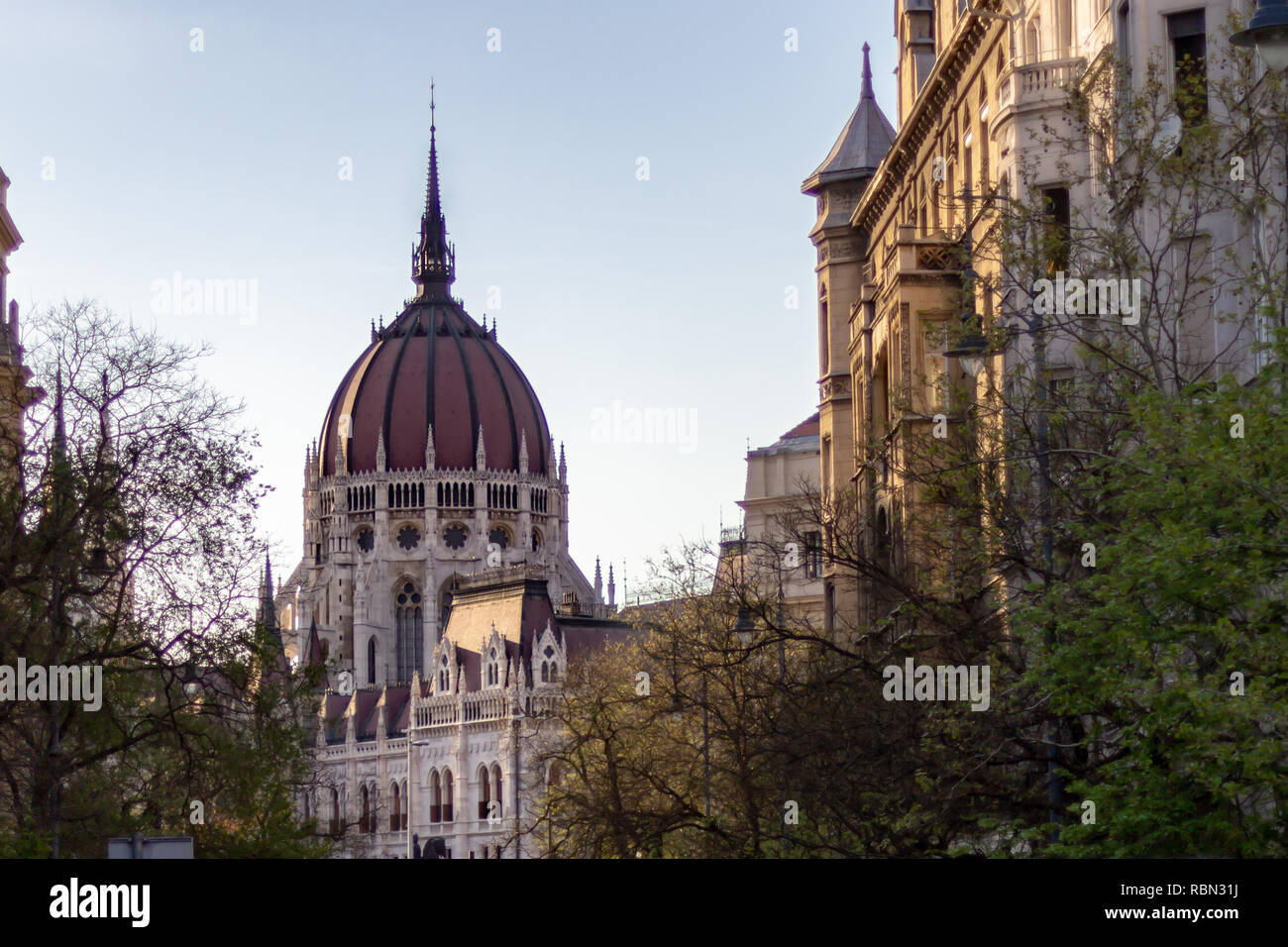 The dome of the Hungarian Parliament Building as seen from a Budapest city street Stock Photo