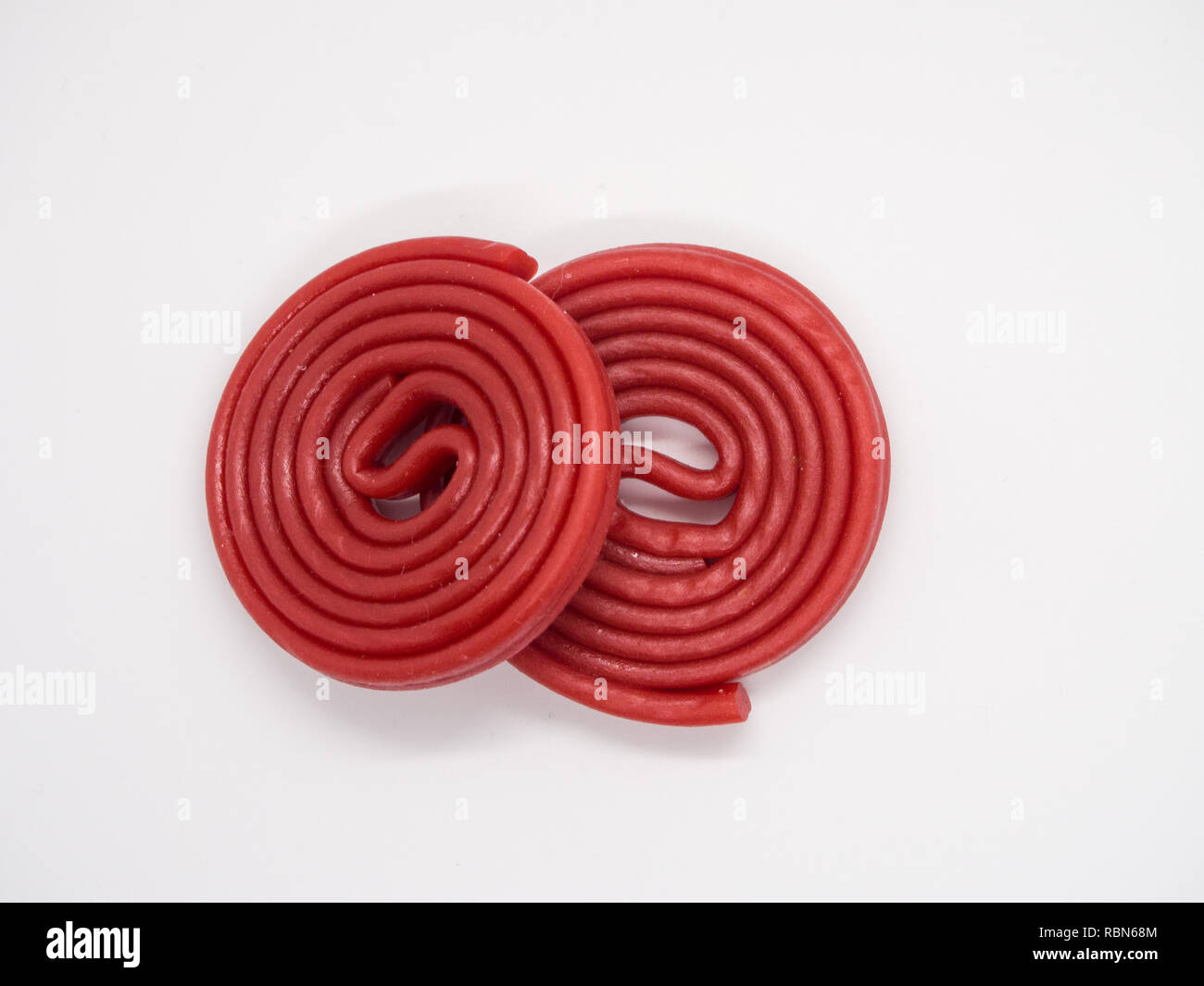 Red licorice on white background Stock Photo Alamy