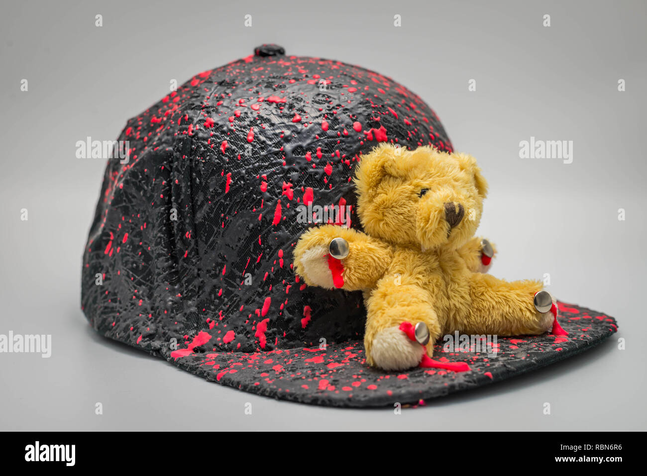 Bear figure doll on a hat, isolated on white background Stock Photo