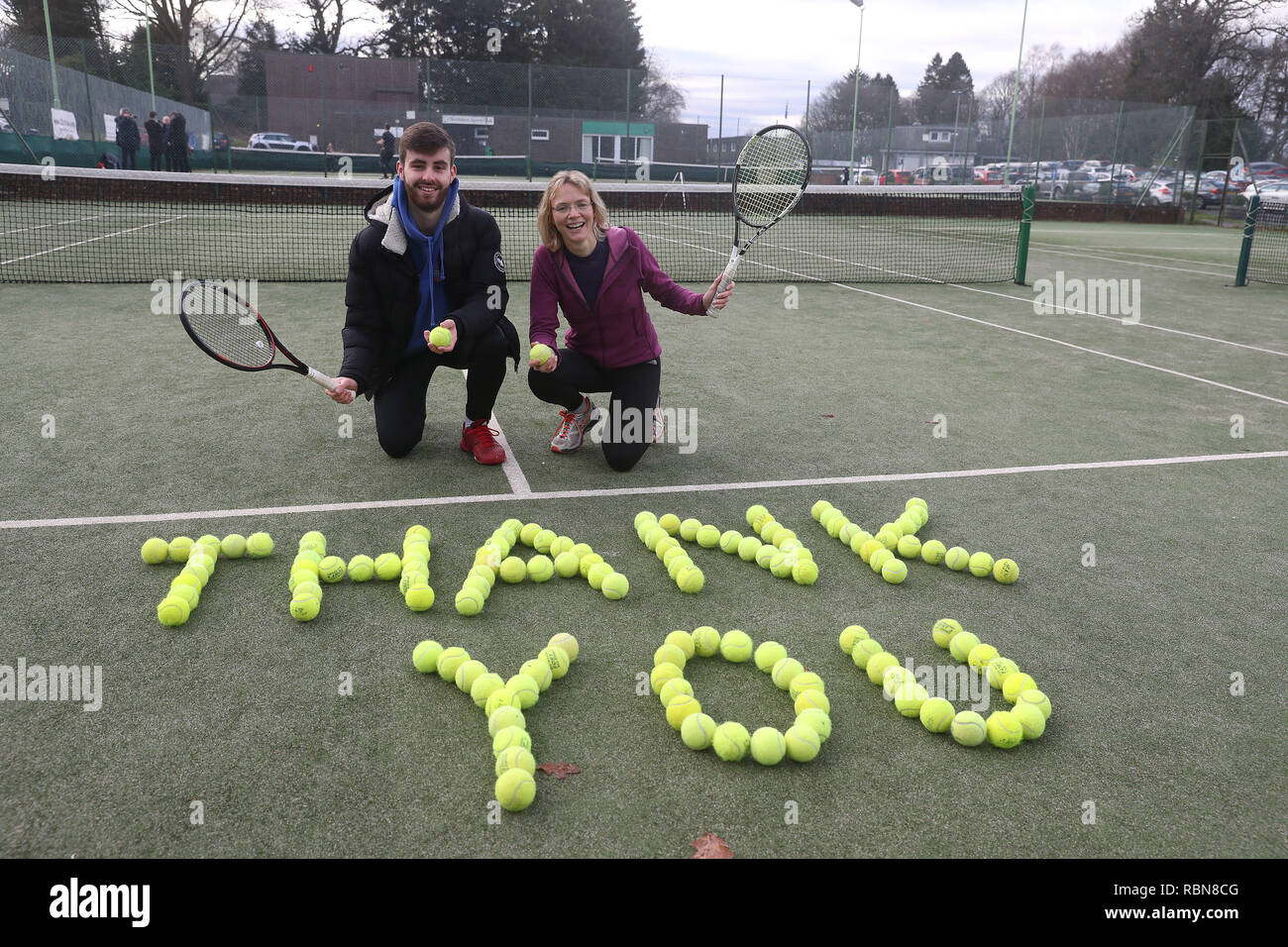 Tennis coach Josh Thomson and Nicola Wishart with tennis balls laid out at Dunblane Tennis Club in Andy Murray's home town, he has said he is aiming to end his career after Wimbledon but the Australian Open may be his last tournament. Stock Photo