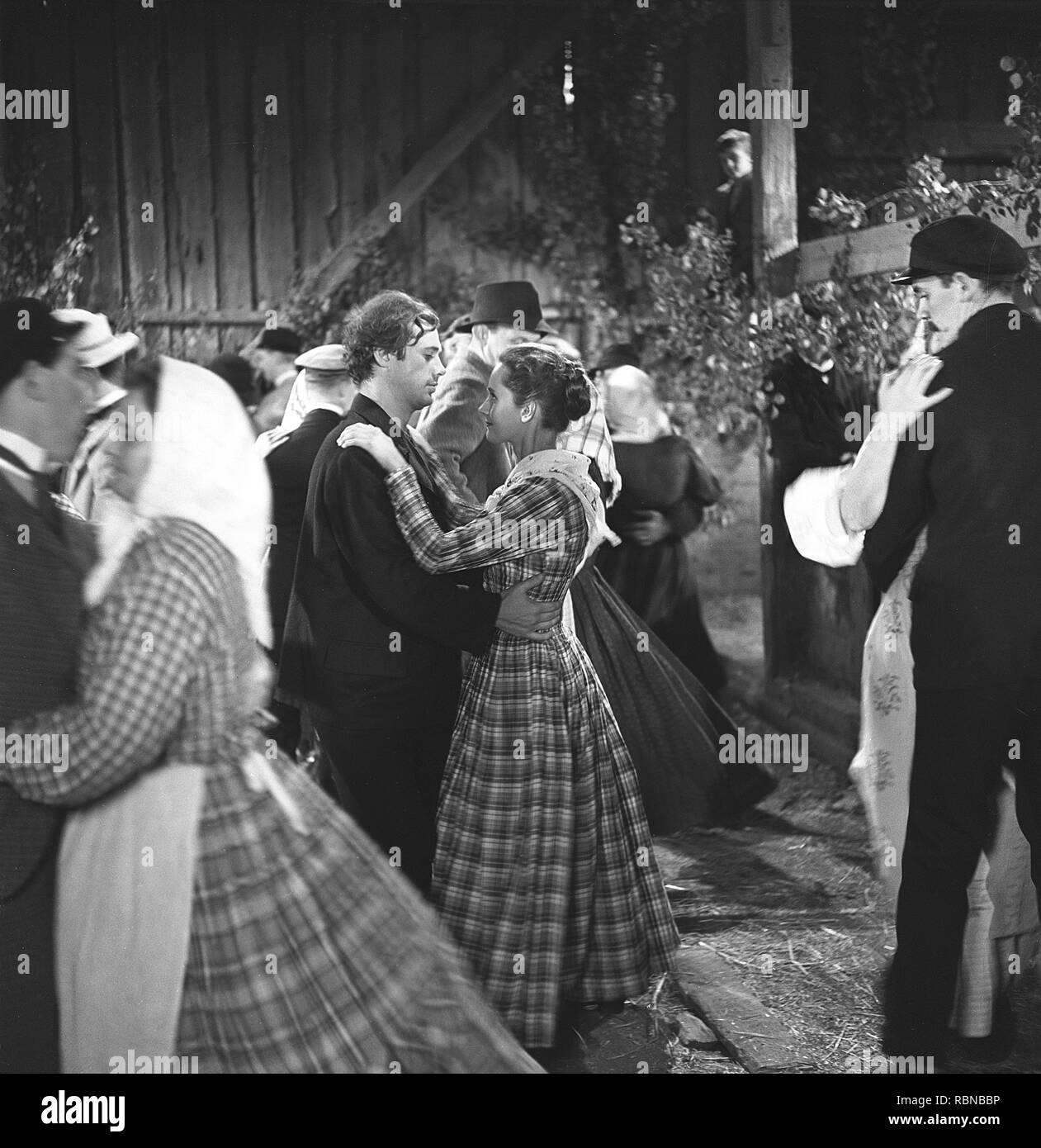 Dance event. People dancing at a rural dance held in a barn house. A historical re-enact during a filming of the swedish movie Folket i Simlångsdalen 1947. Sweden 1958. Ref CV9-12 Stock Photo