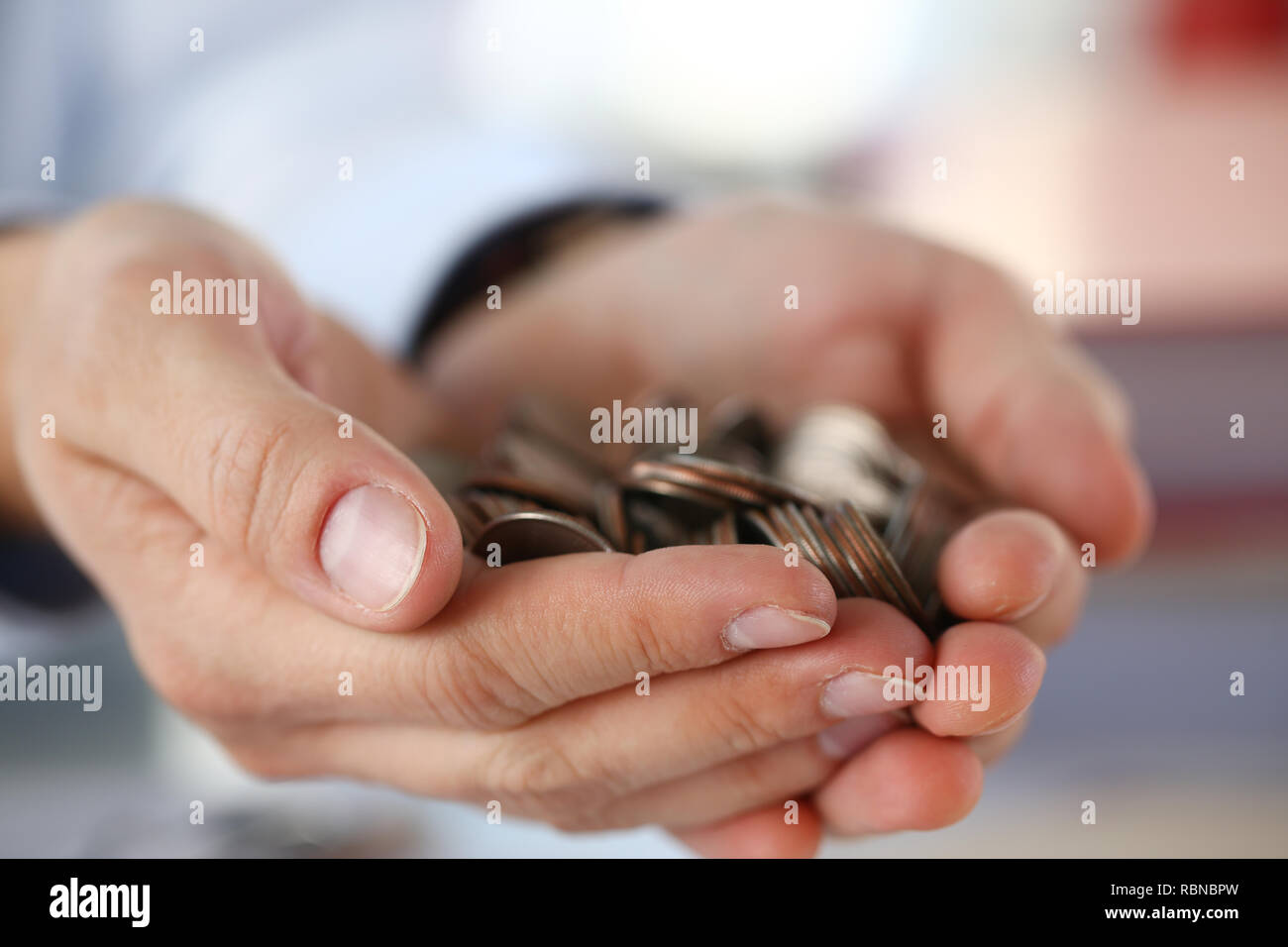 Hand businessman putting pin money Stock Photo Alamy