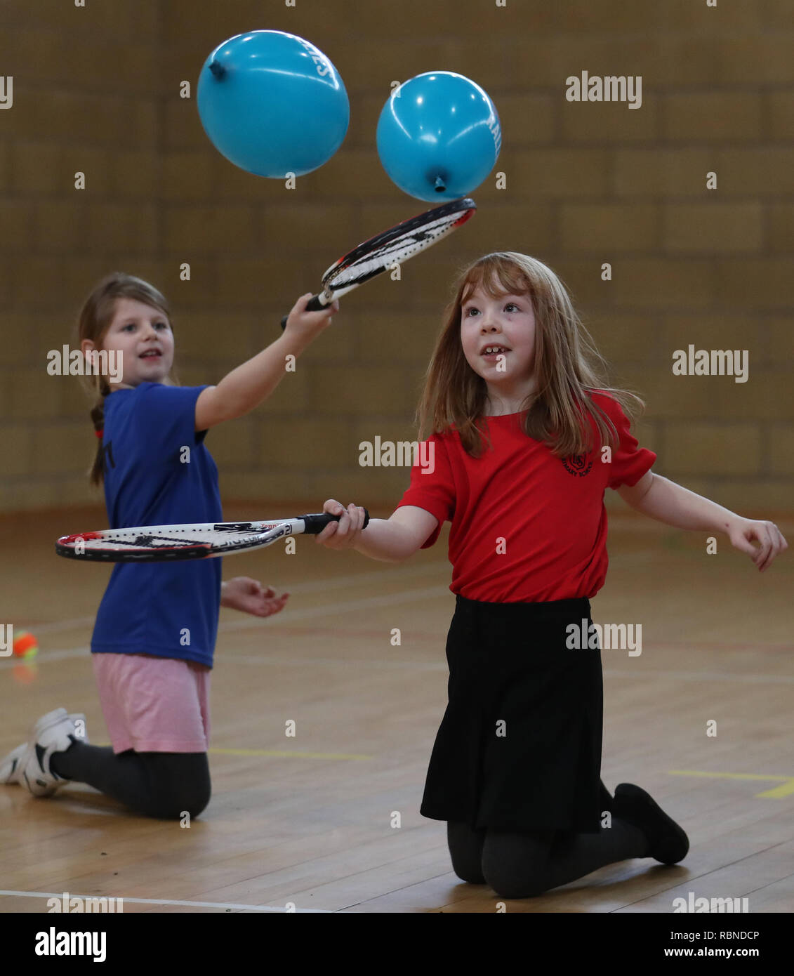 Primary four pupil Evie McKenna(right) alongside classmates at Dunblane Primary as they take part in the schools Miss-hits Tennis club in Andy Murray's home town, he has said he is aiming to end his career after Wimbledon but the Australian Open may be his last tournament. Stock Photo