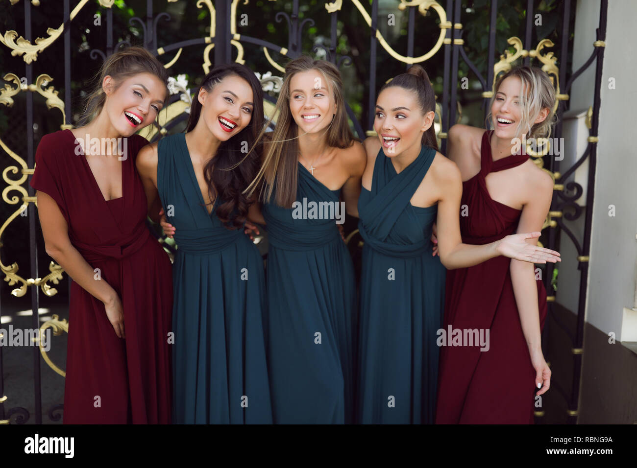 Glamorous girls in the fashion evening dresses posing to make a picture, red, green, having fun, smiling, cheerful, modern, outdoor, make up, party Stock Photo - Alamy Glamorous girls in the fashion evening dresses posing to make a picture, red, green, having fun, smiling, cheerful, modern, outdoor, make up, party Stock Photo - Alamy