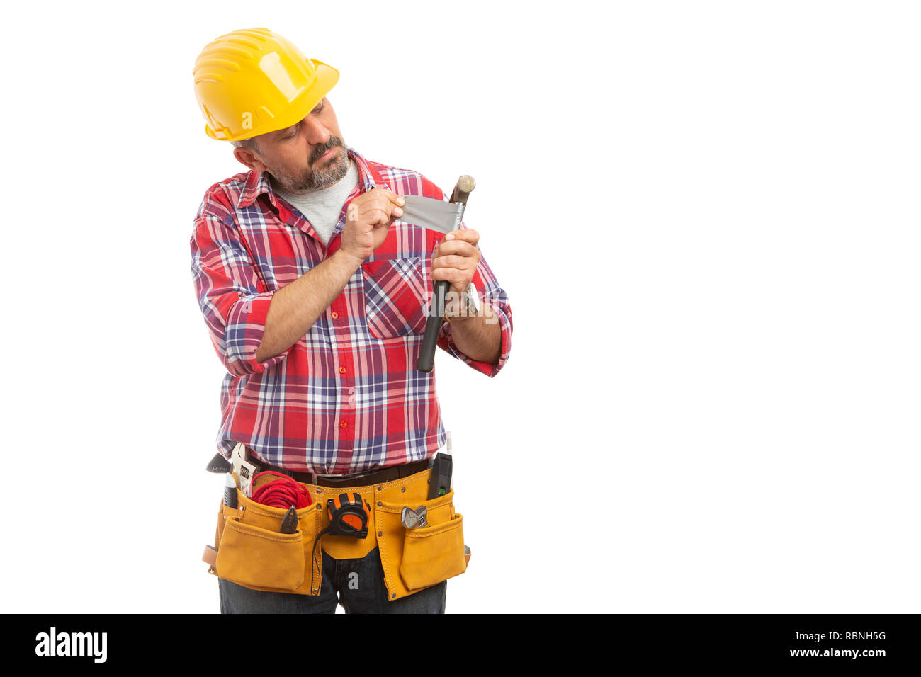 Skilful builder repairing broken hammer with grey ducktape isolated on white studio background Stock Photo