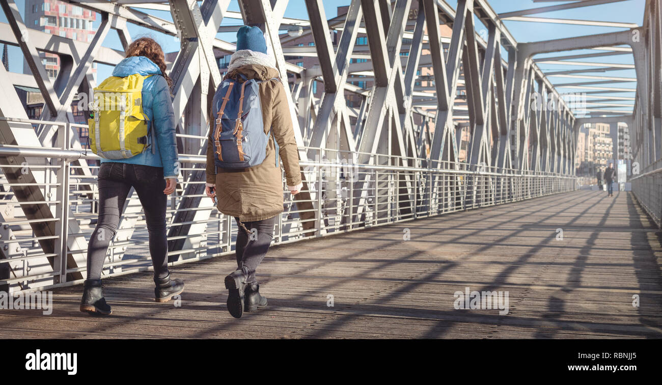 Two young women in warm clothes exploring the city Stock Photo
