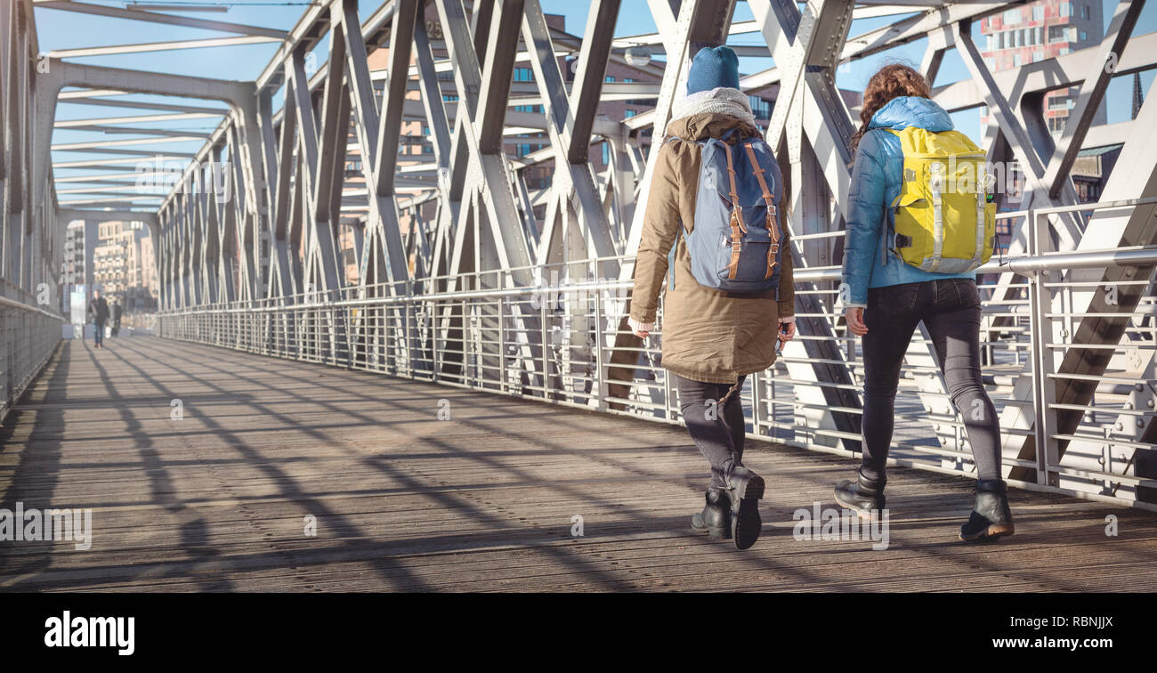 Two young women in warm clothes exploring the city Stock Photo