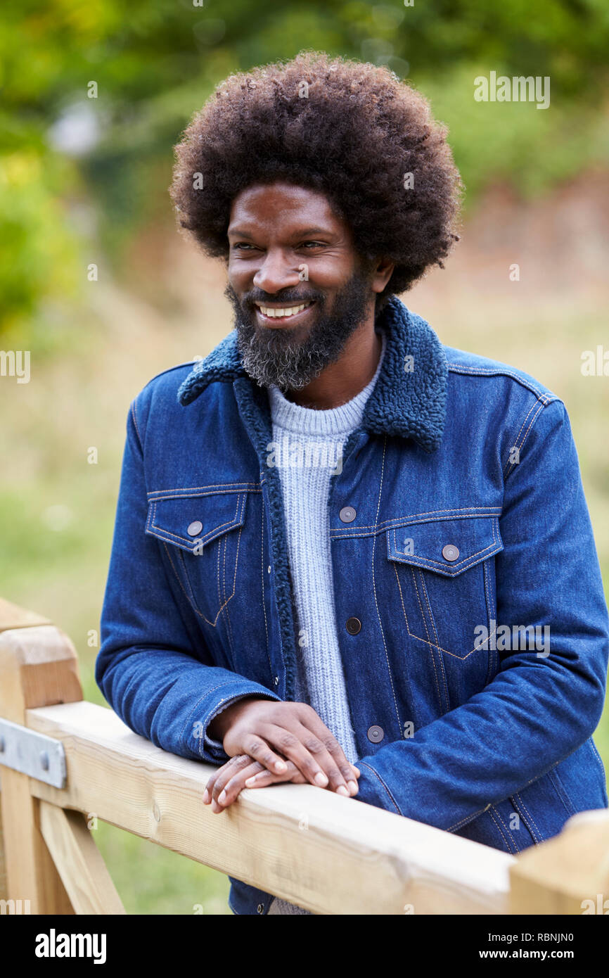 Man on black afro hi-res stock photography and images - Alamy