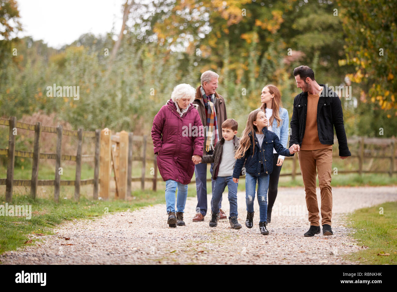 Multi Generation Family On Autumn Walk In Countryside Together Stock Photo