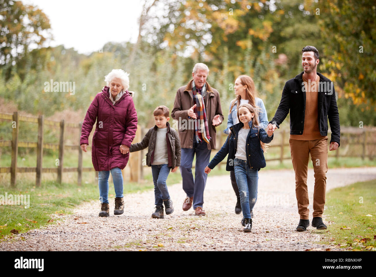 Multi Generation Family On Autumn Walk In Countryside Together Stock Photo