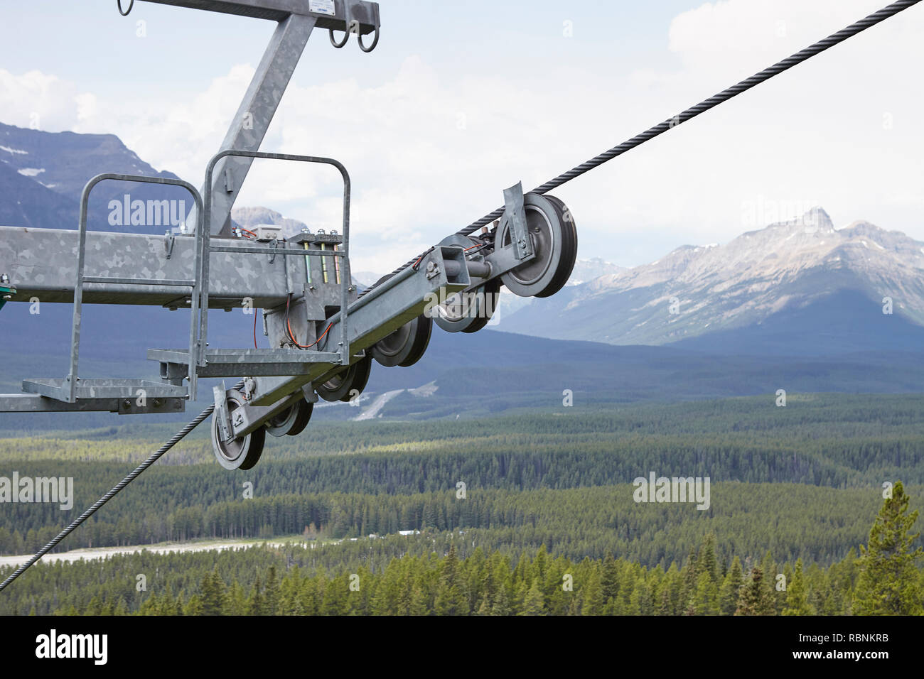 Detail Of Cable Car Mechanism Over Forested Valley In Alaska Stock Photo