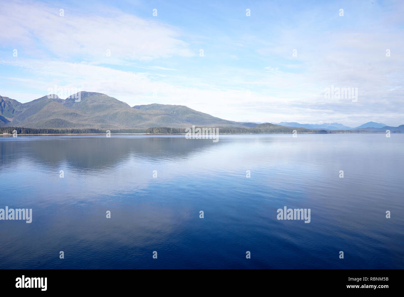 Beautiful Lake In Alaska Surrounded By Mountains And Forests Stock Photo