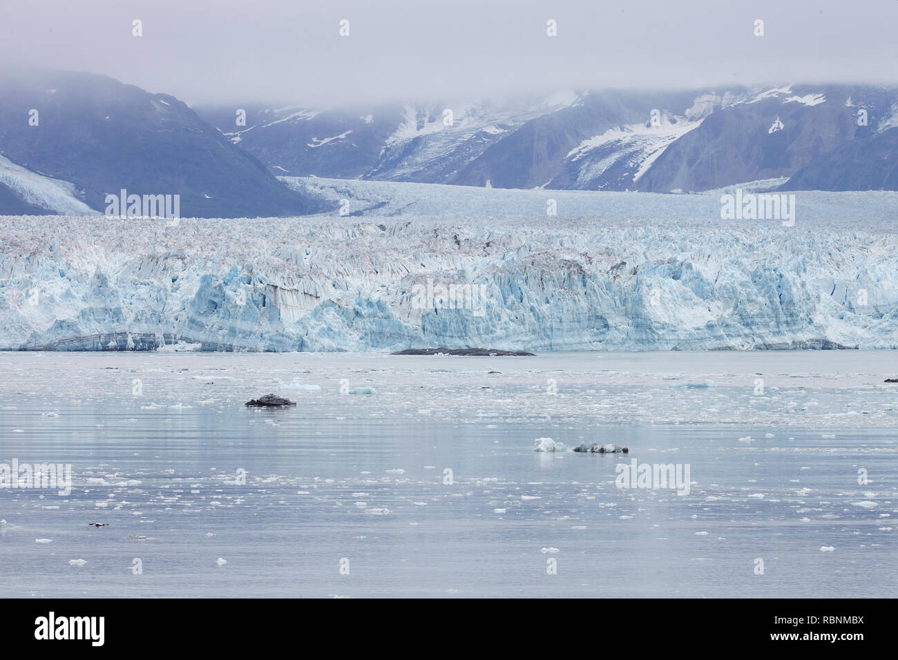 Glacier Flowing Into Lake In Alaska USA Stock Photo