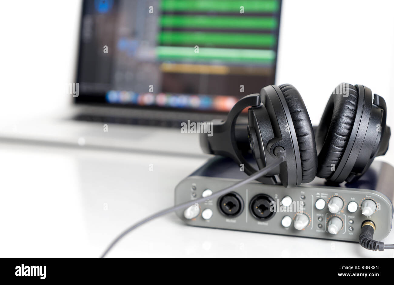 Black Music Studio headphone lying on Computer Sound interface Stock