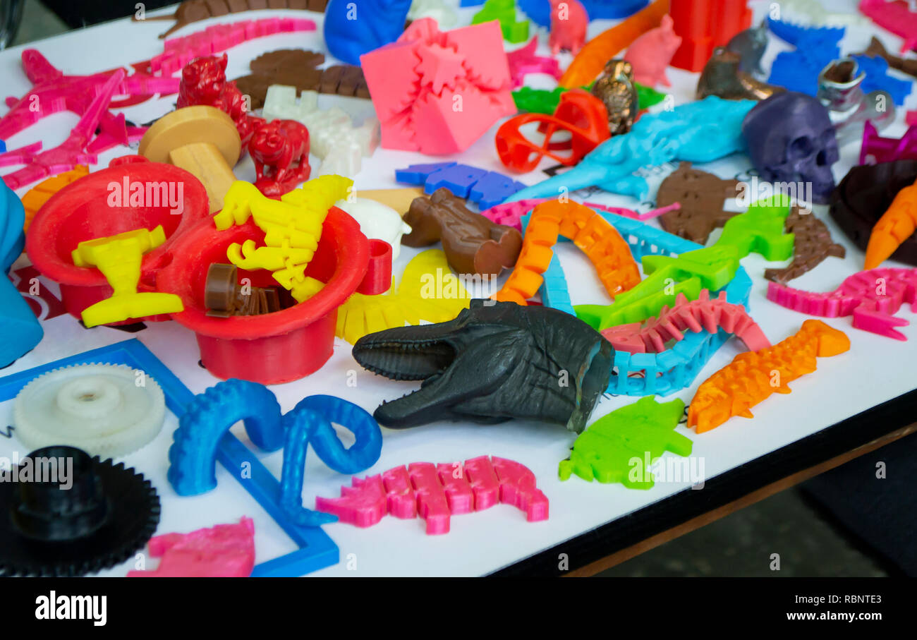 Models printed by 3d printer. Bright colorful objects printed on a 3d ...