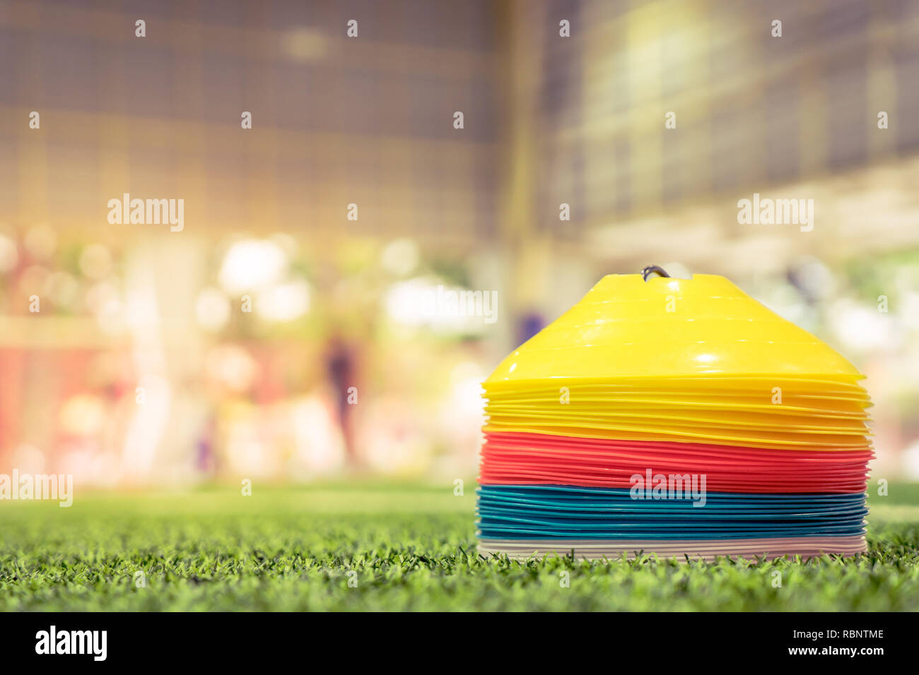 Plastic sport training cone on indoor soccer field Stock Photo Alamy