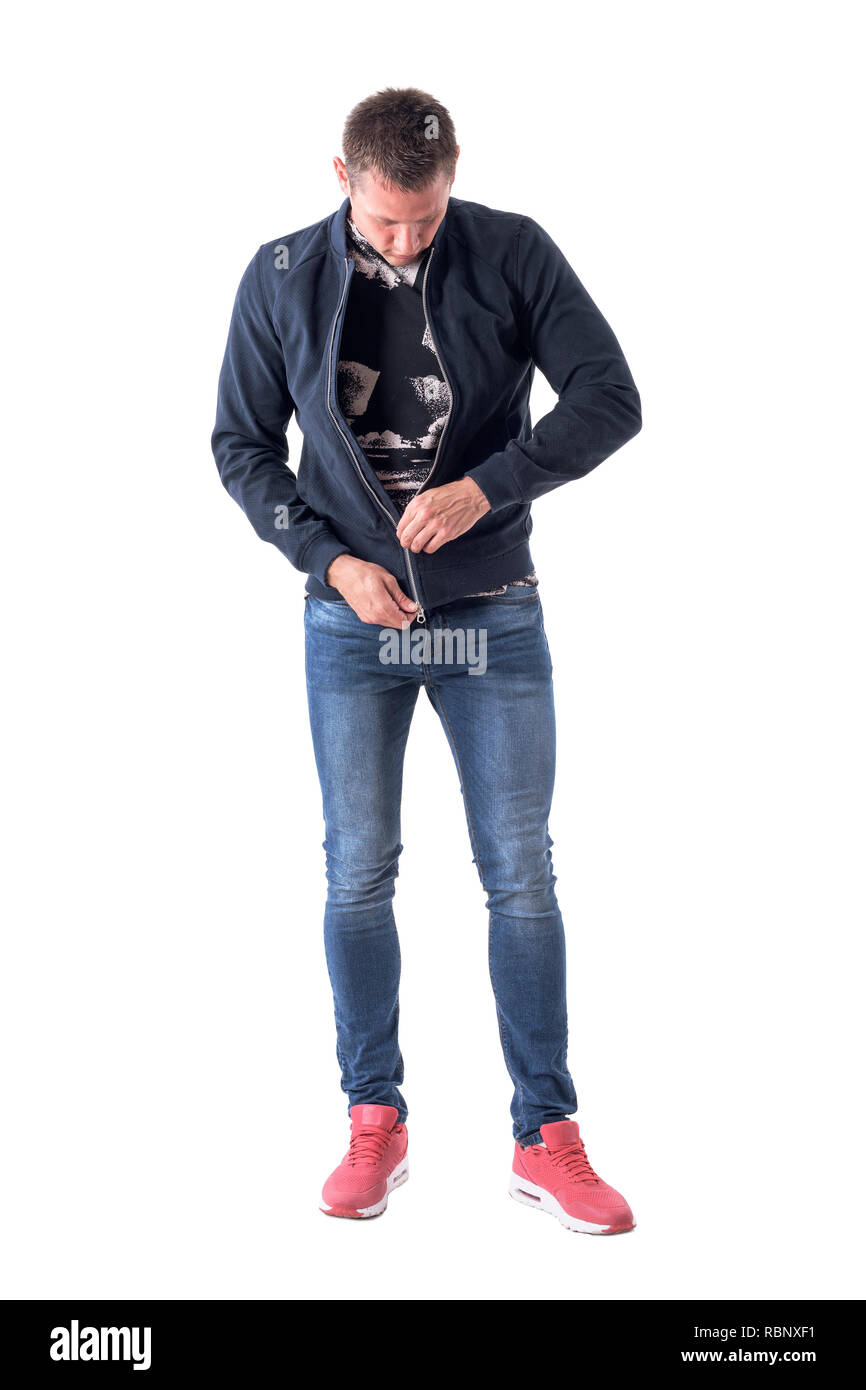 Young adult man zipping up bomber jacket zipper getting dressed. Full