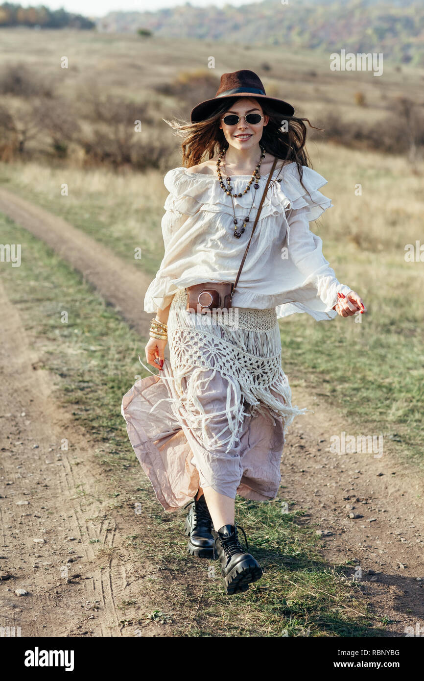 Beautiful hippie girl in hat walking on nature. Freedom lifestyle Stock  Photo - Alamy