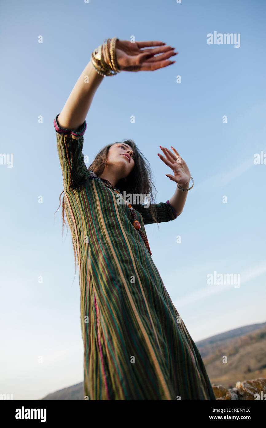 Beautiful boho woman dancing in nature. young and freedom concept Stock Photo
