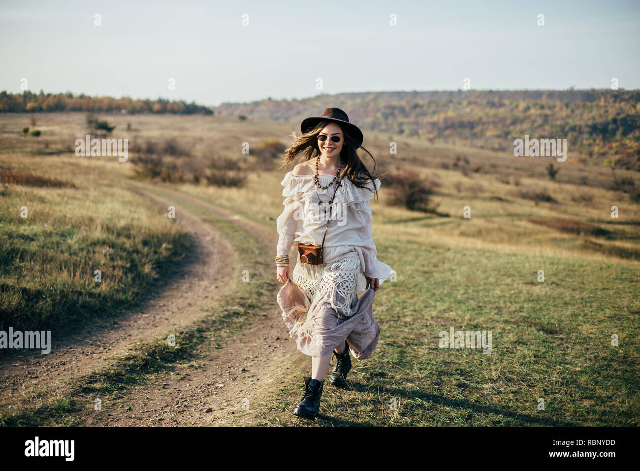 Beautiful young boho woman walking on nature. Freedom lifestyle Stock Photo  - Alamy