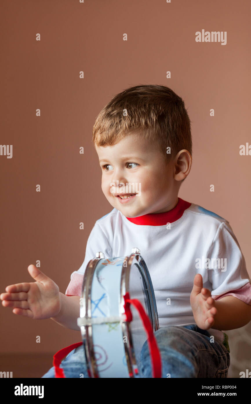 Little boy playing the drum. Lovely baby boy. Child development concept Stock Photo Alamy