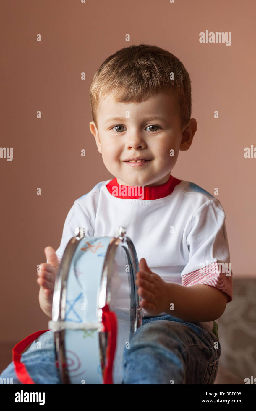 Little boy playing the drum. Lovely baby boy. Child development concept Stock Photo Alamy