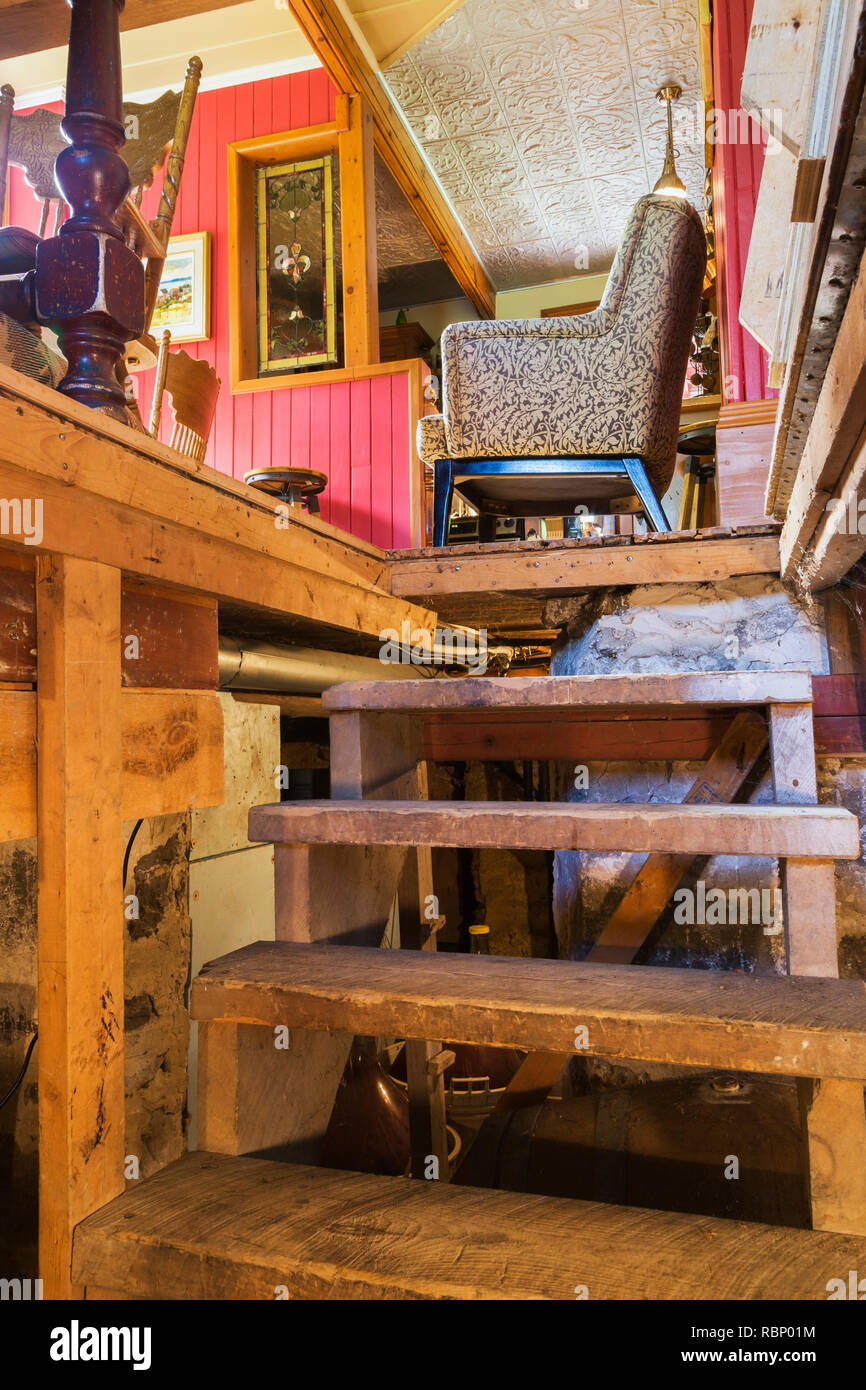 Partial View Of Dining Room Table Leg And Chairs Seen From The Old Wooden Stairs In The Basement Inside An Old Circa 1850 Canadiana Cottage Style Home Stock Photo Alamy