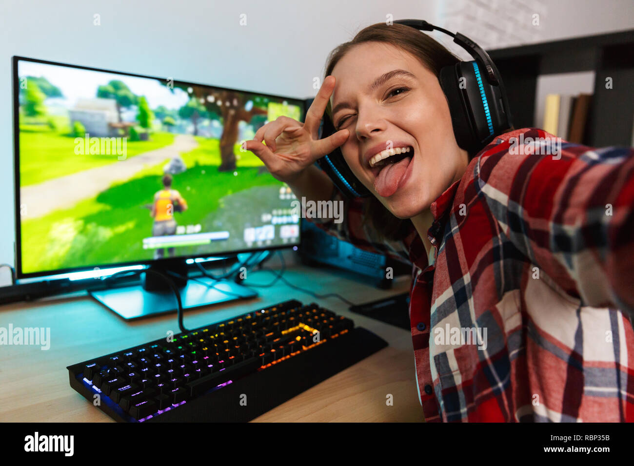 Happy Pretty Blonde Gamer Girl Playing Online Video Game on Her Personal  Computer Stock Photo - Alamy