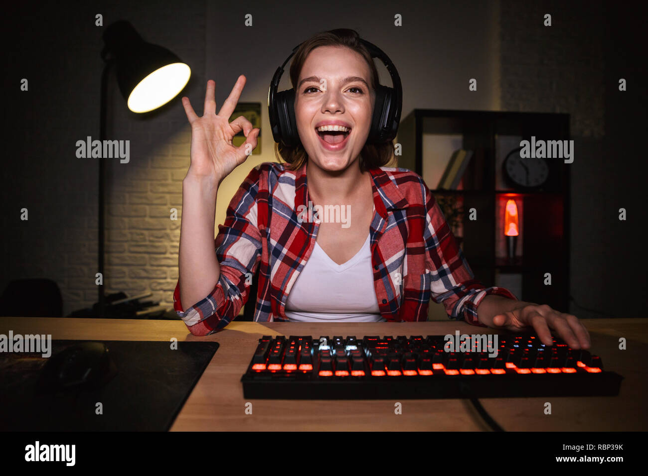 Excited Girl Gamer Sitting at the Table, Playing Online Games Stock Image -  Image of headset, esports: 136171701