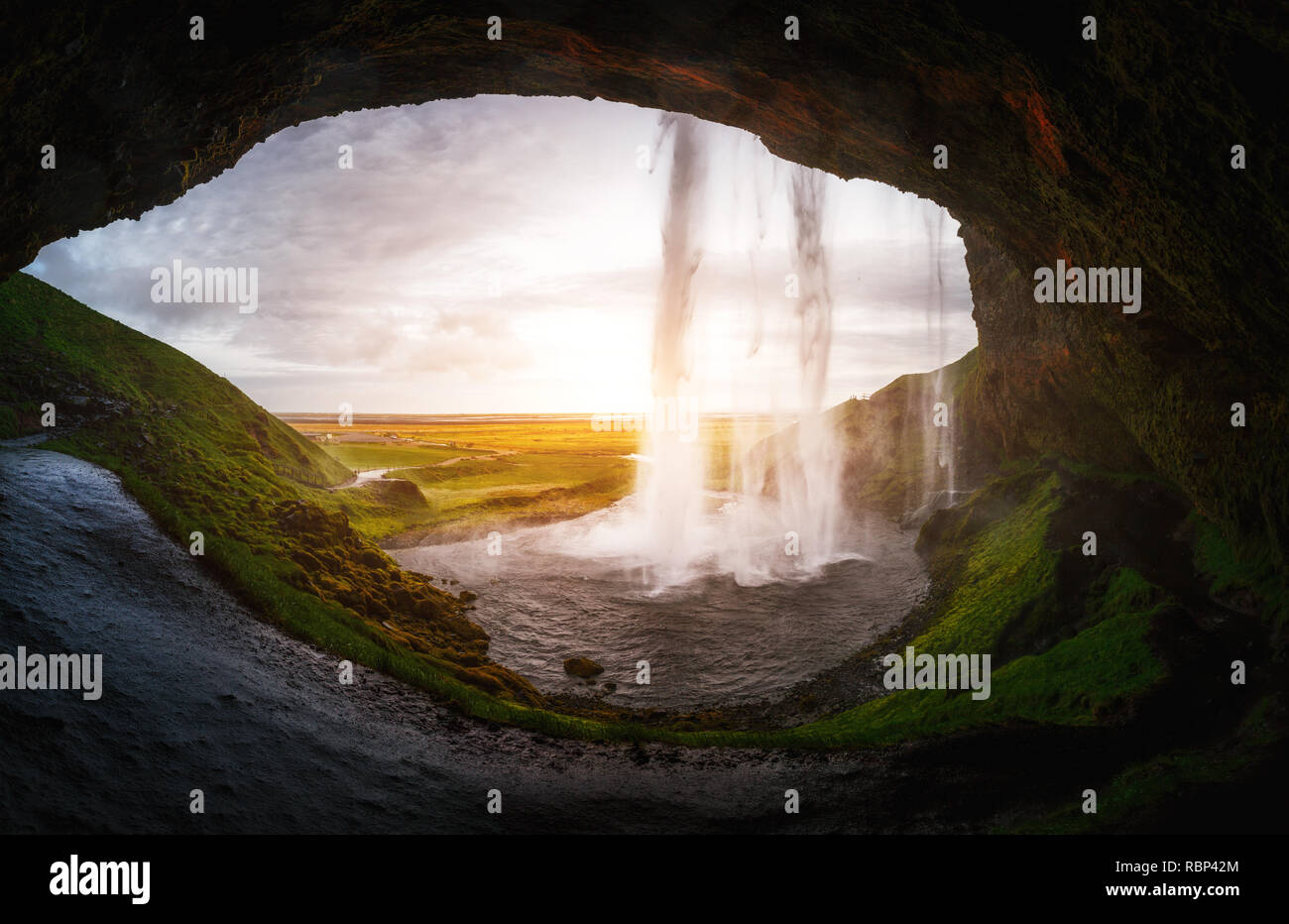 Perfect view of famous powerful Seljalandsfoss waterfall in sunlight. Dramatic and gorgeous scene. Popular tourist attraction. Location place Iceland, Stock Photo