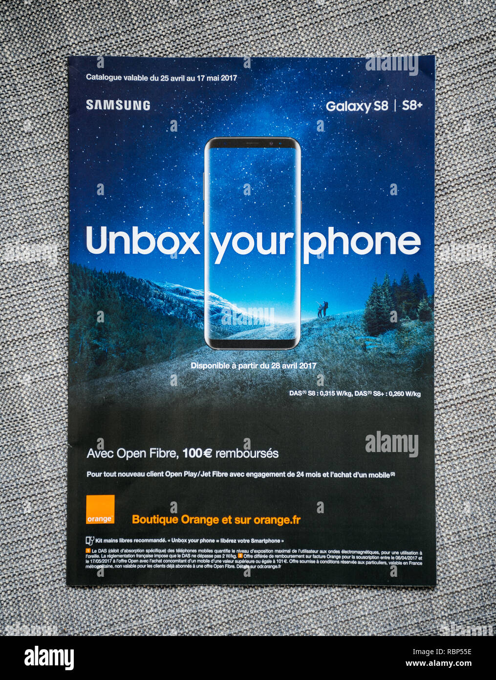 PARIS, FRANCE - APR 26, 2017: Unbox Your phone advertising campaign for  Samsung Galaxy Smartphone S8 from Orange Telecom on the last page of a  fashion magazine newspaper Stock Photo - Alamy