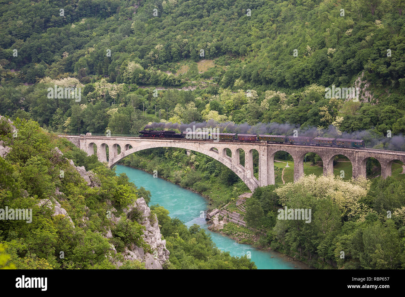 Old Steam train at the stone bridge of Solkan, Slovenia Stock Photo