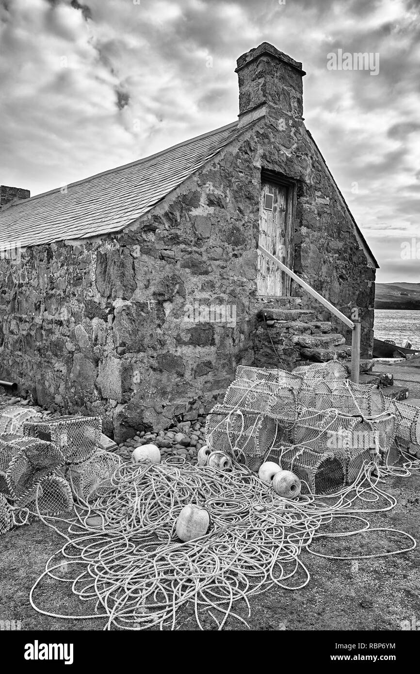 Fisherman's hut and tackle at Milovaig, Duirinish, Isle of Skye, Highland, Scotland.  Black and White Stock Photo