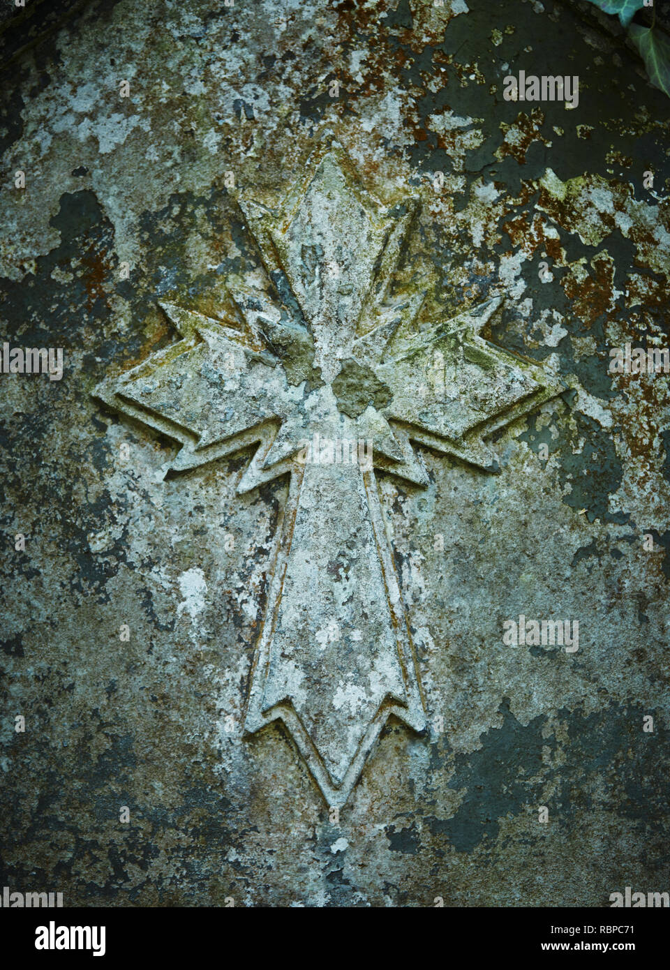 an Old carved in stone cross. Close-up Stock Photo