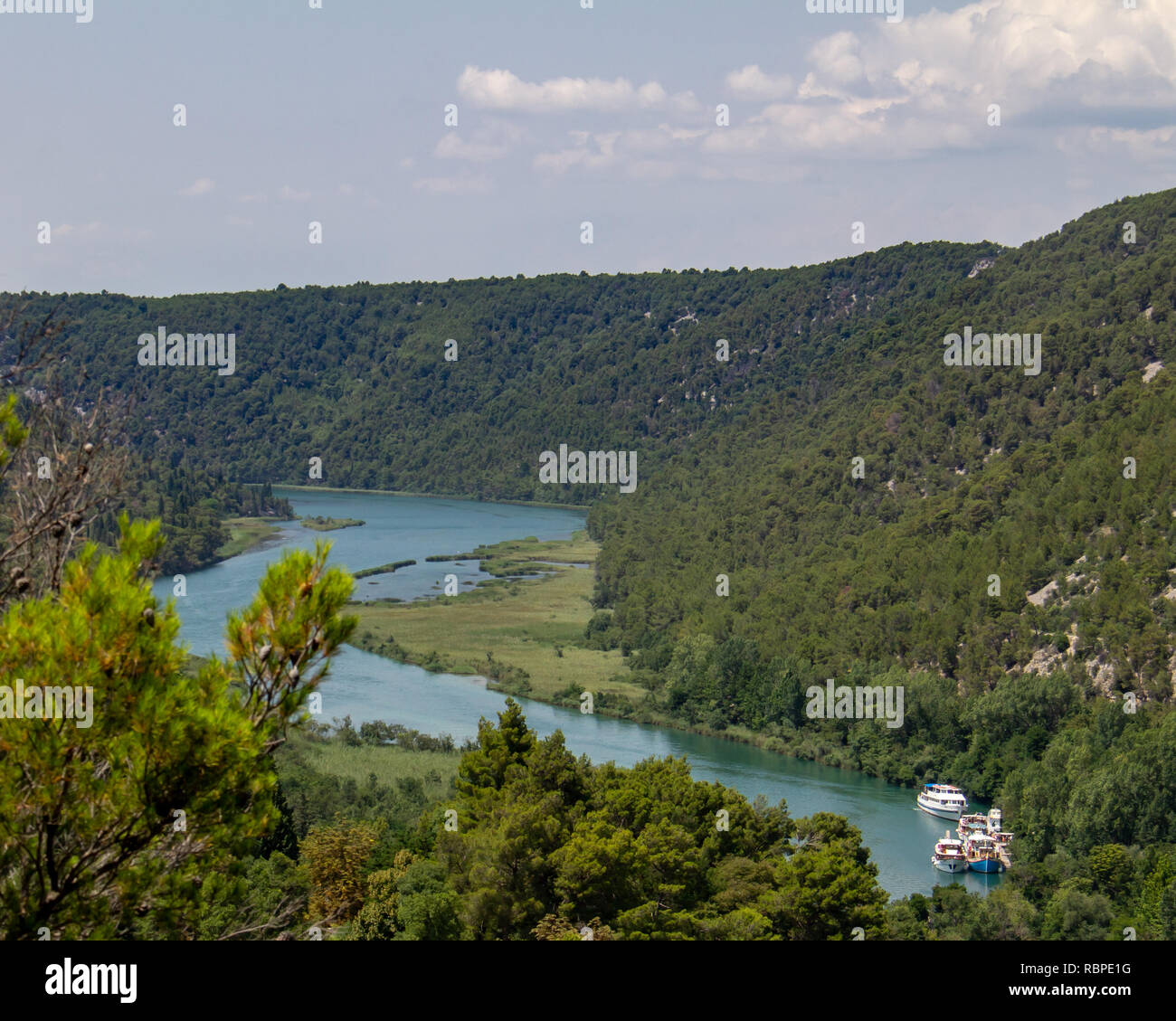 Boats are docked on the Krka River in the Krka National Park in Croatia Stock Photo